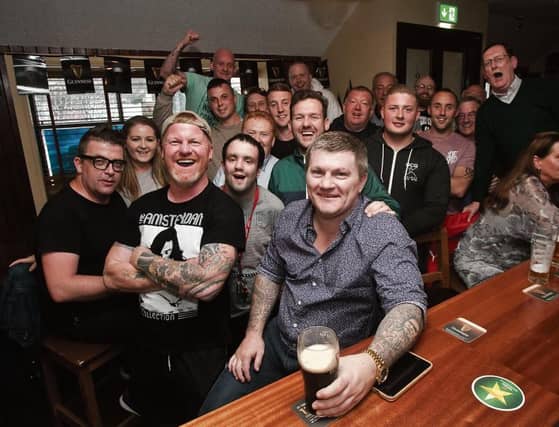 Former World Light-Middleweight Boxing Champion, Ricky Hattonenjoys a pint of Guinness with locals at Cookes Thatch Bar. Photo: Iain McDonald.