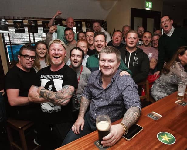 Former World Light-Middleweight Boxing Champion, Ricky Hattonenjoys a pint of Guinness with locals at Cookes Thatch Bar. Photo: Iain McDonald.