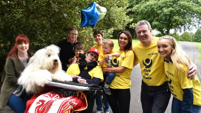 Orla Cahill and her dog Floyd, Briain McNamara (Greenpark Nursing Home), John Stockwell, Shane, Joan, Harry, Sarah and Joe Grogan and Maeve Kelly (Occupational Therapist to Shane) at the Care for Shane Balloon Race at the Palace Grounds in Tuam.