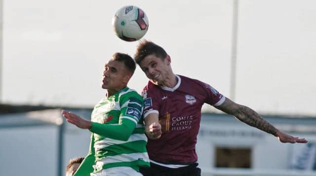 Galway United's Gavan Holohan wins this ariel duel with Graham Burke of Shamrock Rovers during the SSE Airtricity League tie at Eamonn Deacy Park on Friday. Photo: Iain McDonald.