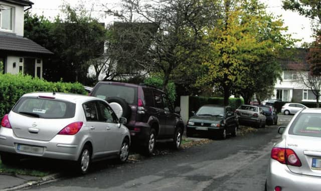 Illegally parked cars on match day at Pearse Stadium.