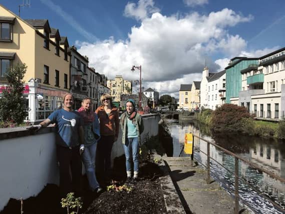 Keith Ryan, Martina Finn, Megan Bromley and Rósín Ní Fhaoláin working on one of the beds that make up part of Galway's new food growing and permaculture trail on the Eglinton Canal.