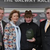 Frank Berry, Racing Manager for JP McManus, accepts the winners trophy after Persistent won The Galway City and Salthill Publicans Charity Handicap Hurdle at Ballybrit on Tuesday. Also included are, Terry and Patsy Tyson, Tom McDonagh and Triona Cosgrove.