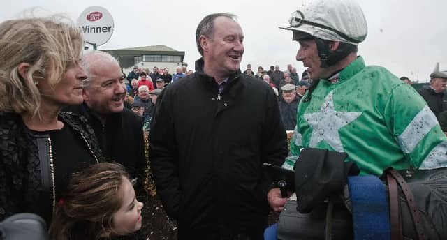 Winning Galway trainer Pat Kelly and jockey Davy Russell after Presenting Percy's impressive chasing debut at Ballybrit.