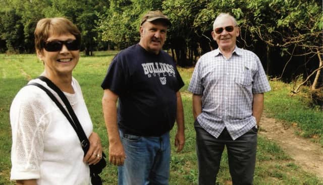 Maura and Frank Curley with their cousin, Bob Curley (centre) on the Curley farm in West Terre Haute, Indiana.