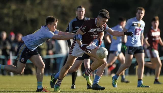 NUI Galway's Damien Comer comes under pressure from UCD' Conor McCarthy in the Sigerson Cup final on Saturday.