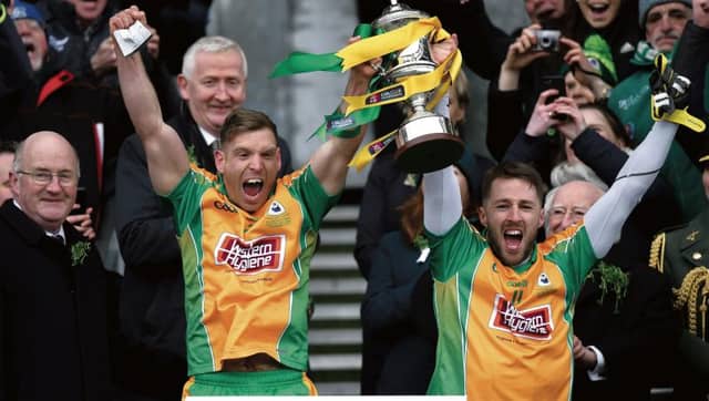 Corofin joint captains Ciarán McGrath and Micheál Lundy lift the Andy Merrigan Cup after routing Nemo Rangers in the All-Ireland Club football final at Croke Park on Saturday. Photo: David Fitzgerald/Sportsfile