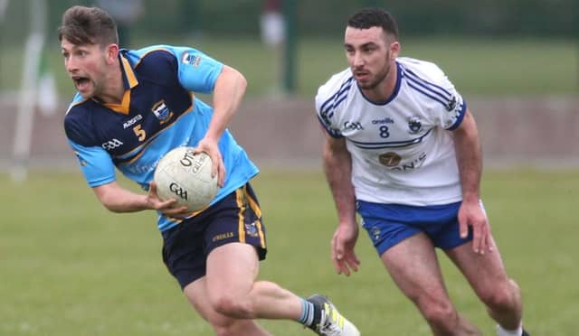 Salthill Knocknacarra's Evan Wynne breaking away from Ronan Caldwell of Killannin during the clubs' county football championship encounter in Moycullen. Photos: Joe O'Shaughnessy.