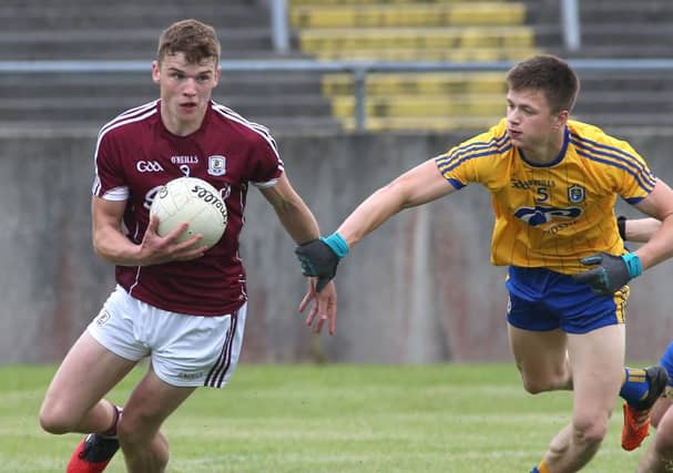 Galway's John Daly takes on Roscommon's Aidan Dowd during Saturday's Connacht U20 football championship clash at Tuam Stadium