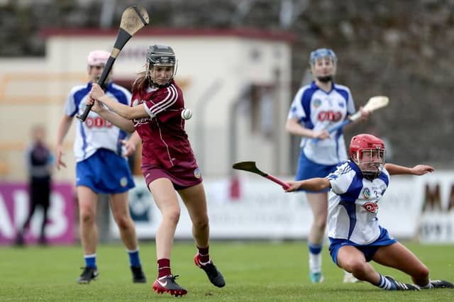 Galway's Carrie Dolan fires home a goal despite the best efforts of Waterford's Mairead Power during Saturday's All-Ireland camogie championship clash at Kenny Park.
