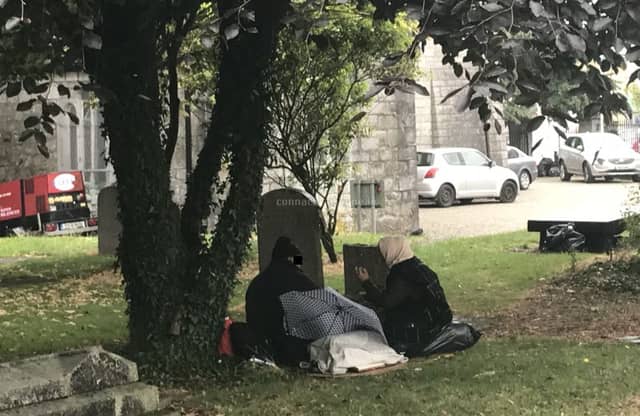 Homeless people on the grounds of St Nicholas' Collegiate Church in Galway.