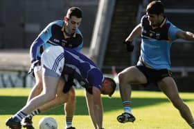 Cathal Blake of Milltown is challenged by Andrew Butler and John Maher of Salthill Knocknacarra in the sides' quarter-final replay in Pearse Stadium on Sunday. Photos: Iain McDonald.