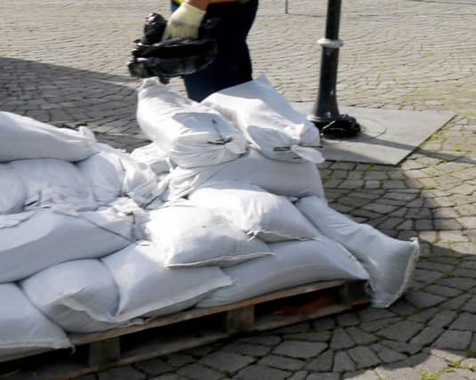Sandbags being distributed at Fishmarket Square.