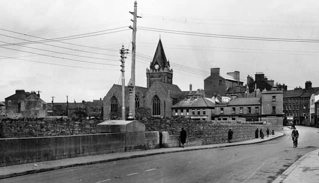 O'Brien's Bridge, Galway in the 1940s, with St Nicholas' Collegiate Church in the background and before St Patrick's National School was built on Lombard Street.