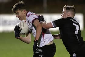 Fr Griffin's/Éire Óg's Darren Moylan comes under pressure from Gary Lally of Padraig Pearses during the County Junior A football final at Duggan Park last Friday. Photos: Joe O'Shaughnessy.