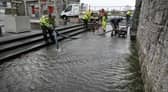 Galway City Council workers pumping water from a flooded area behind the Spanish Arch during Storm Callum. PHOTO: JOE O'SHAUGHNESSY.