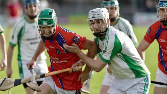 St Thomas' David Burke tussling for possession with Sarsfields' Niall Morrissey during Sunday's senior hurling semi final at Kenny Park. Photos: Brian Harding.