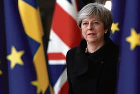 Flags of convenience... British Prime Minister Theresa May.