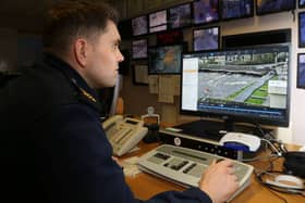 Garda Paddy Moran looking at the live display of the River Corrib at Wolfe Tone Bridge in the control room at Mill Street Garda Station. PHOTO: JOE O'SHAUGHNESSY