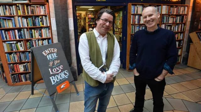 Charlie Byrne and Vinny Browne outside the bookshop in the Cornstore, Middle Street, Galway.