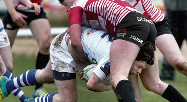 Garbally's James Carry drives forward for a few extra yards. Photos: Joe O'Shaughnessy.