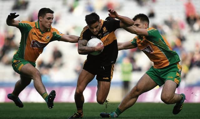 Micheál Burns of Dr. Crokes' is tackled by Corofin's Dylan Wall and Cathal Silke during Sunday's All-Ireland Club senior football final at Croke Park. Photo: Harry Murphy/Sportsfile