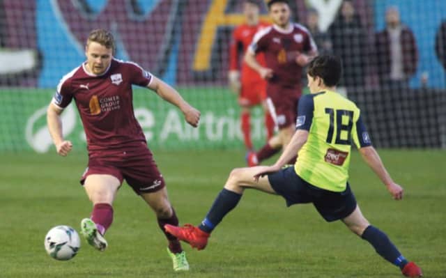 Galway United's Joe Collins is challenged by Stephen O'Leary of Cobh Ramblers during Friday night's First Division tie at Eamonn Deacy Park. Photo: Joe O'Shaughnessy.