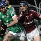 Clarinbridge’s Shane Bannon tries to halt the progress of Ballinderreen’s Roy Lane during Saturday's senior hurling championship tie at Pearse Stadium.  Photos: Enda Noone.