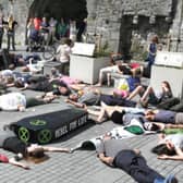 Extinction Rebellion Galway ‘die-in’ protest at the Spanish Arch last Saturday. PHOTO: JOE O SHAUGHNESSY.