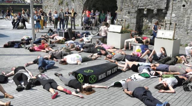 Extinction Rebellion Galway ‘die-in’ protest at the Spanish Arch last Saturday. PHOTO: JOE O SHAUGHNESSY.