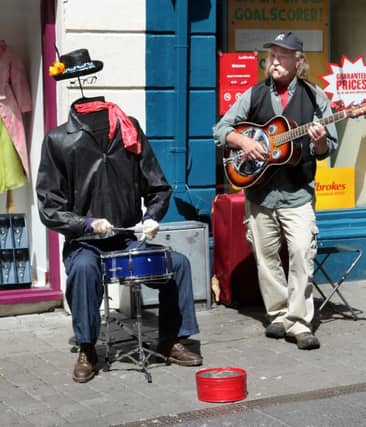 A busker on High Street in June 2010. . . the bye-laws restricting busking in city centre are a sad day for Galway and free speech (Photo: Joe Shaughnessy)