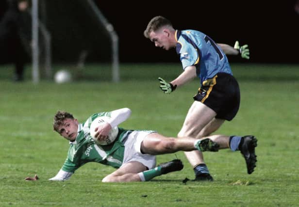 Moycullen's Daniel Cox secures possession ahead of Salthill/Knocknacarra's Harry Devlin, during the West Board Minor A football final in Loughgeorge on Tuesday evening. Photos: Joe O'Shaughnessy.