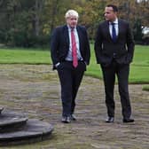 A fountain to climb... Boris Johnson and Leo Varadkar on walkabout in the Wirral.