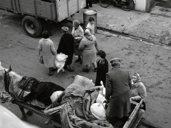 Getting Christmas ready at the Christmas Market in Galway in December, 1964.
