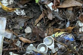 Disposable spoons, used syringes and tin foil beside The Plots.