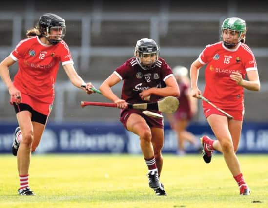 Galway Sports Stars camogie award winner Niamh Kilkenny in action against Cork's Orla Cotter and Hannah Looney during last year's All-Ireland semi-final.