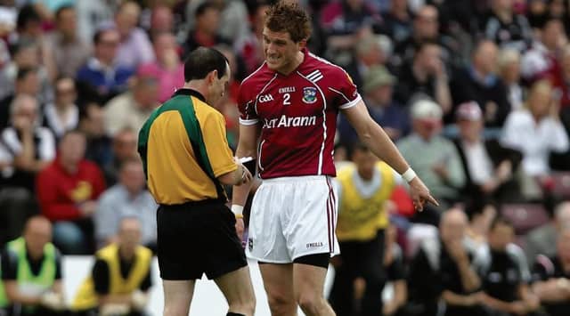 Footballing legend Kieran Fitzgerald, who announced his retirement this week, falls fouls of referee David Coldrick during his time playing for Galway.