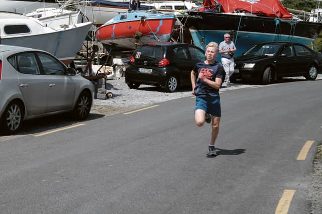 Daragh makes a final sprint for the finsih line at Rinville Pier.