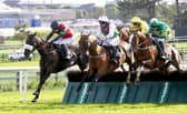 Aramon and jockey Patrick Mullins, centre, jump the final flight alongside Hunters Call, left, and Hearts Are Trumps before landing the Guinness Galway Hurdle at Ballybrit last Thursday.