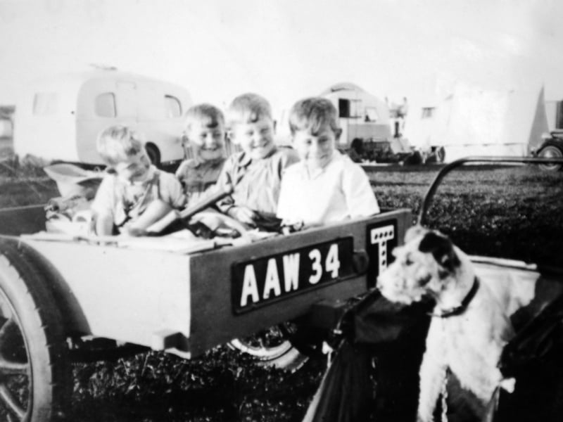 If the weather was fine, nothing beat a trip to the seaside. Shared by Dorothy Martin, this charming photograph from the late 1950s or 1960s captures the Martin boys from Wellington packed into a trailer, setting off for Rhyl. With Arthur, the family dog, sitting proudly alongside for the ride, the family of local vets embarked on a classic British summer adventure. It serves as a delightful reminder of simpler times, open roads, and the excitement of traditional coastal holidays. Do you remember family road trips to the North Wales coast from Shropshire, or did you ever travel in a makeshift setup like this?