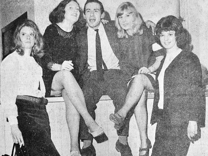 Captured in November 1965, Mr Tony Connerty poses with a group of local girls celebrating the grand opening of the 7 Club on Wyle Cop in Shrewsbury. Showing off quintessential 1960s Mod fashion, from backcombed beehives and fringe cuts to tailored suits and slim ties, the snapshot preserves the buzz surrounding an exciting new hotspot for the town’s youth during the height of the Swinging Sixties. Were you there on opening night at the 7 Club, or do you remember going to dances and music venues around Wyle Cop in the 1960s?