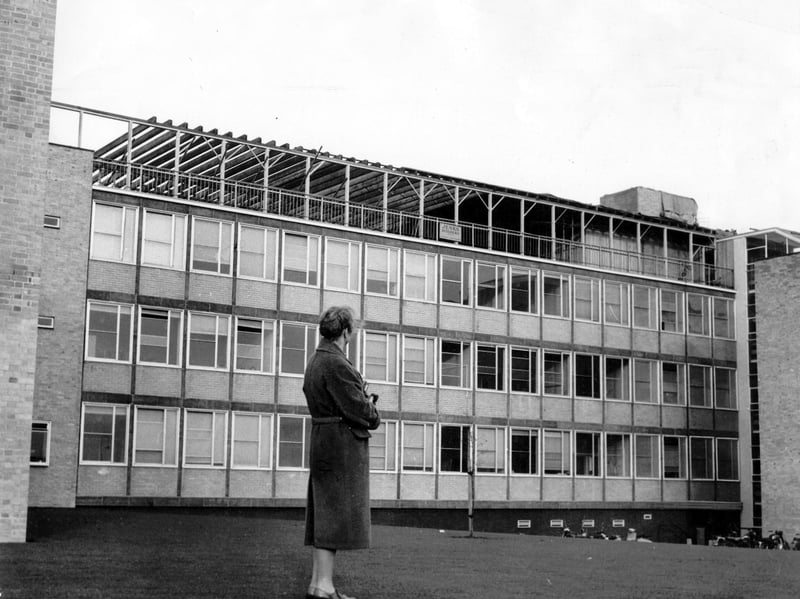 A lone woman stands looking towards the extension of Shrewsbury Technical College as it takes shape on January 10, 1962. The construction site offers a glimpse of a changing Shrewsbury, with new development signalling ambitions for the town's future. Do you remember this building project or the college as it looked in the 1960s?