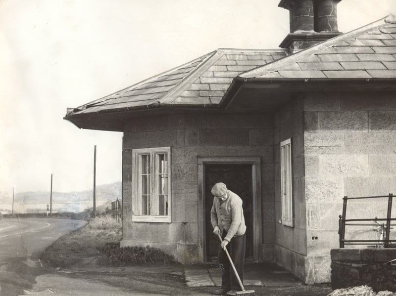 The distinctive Umbrella House near Wellington stands quietly beside the road on February 25, 1960, with a man sweeping outside its unusual canopy roof. The charming landmark, dating back to 1835, was once a toll-house and had long been admired for its distinctive design. This peaceful scene captures the building as it appeared more than 60 years ago, before the bustle of modern traffic. Do you remember the Umbrella House? Did you ever stop to admire its unusual roof when passing through the area?