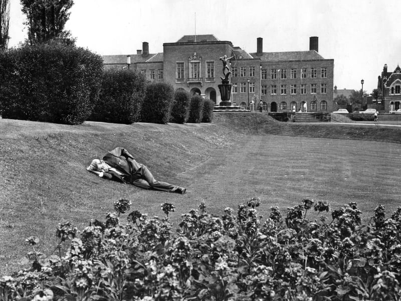 It's not exactly a bed of roses, but Dudley's Coronation Garden's proved an attractive spot for this man to take forty winks in the July sunshine in 1965.