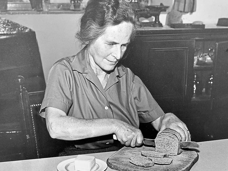 Mrs S Mayall of Lea Hall, Harmer Hill, is pictured slicing a small homemade loaf on July 23, 1960, with a plate of butter ready beside her. The wheat used to make the bread had been supplied by her husband, giving this simple kitchen scene a lovely connection to the family farm. It’s a charming glimpse of a time when making your own bread could be part of everyday rural life in Shropshire. Do you remember homemade bread like this? Did your family grow or use its own wheat for baking?