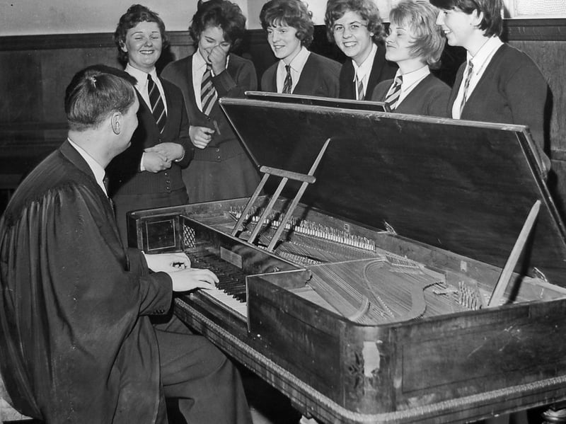 Music master Mr J Buckley plays a tune for an admiring group of pupils at Rugeley Grammar School in March 1962. Equally adept at classical and jazz, Mr Buckley sits at a rare square piano built by John Broadwood and Sons Ltd of London around the turn of the 19th century. Rescued from a damp garage where it had been left lying on its side, the historic instrument was specially loaned to the school to accompany their end-of-month production of The Beggar's Opera. Do you remember taking part in school plays or music lessons at Rugeley Grammar back in the 1960s?
