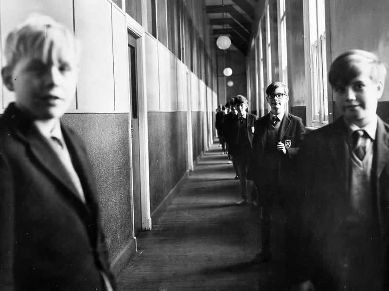 A disappearing line of schoolboys in full uniform stretches down part of the corridor length inside the renovated 'Long Dorm' at The Royal School, Wolverhampton, in November 1966. Though somewhat changed from the layout earlier generations of pupils would remember, this grand space remained a central fixture of school life. Do you remember walking down this corridor or boarding in the Long Dorm back in your school days?