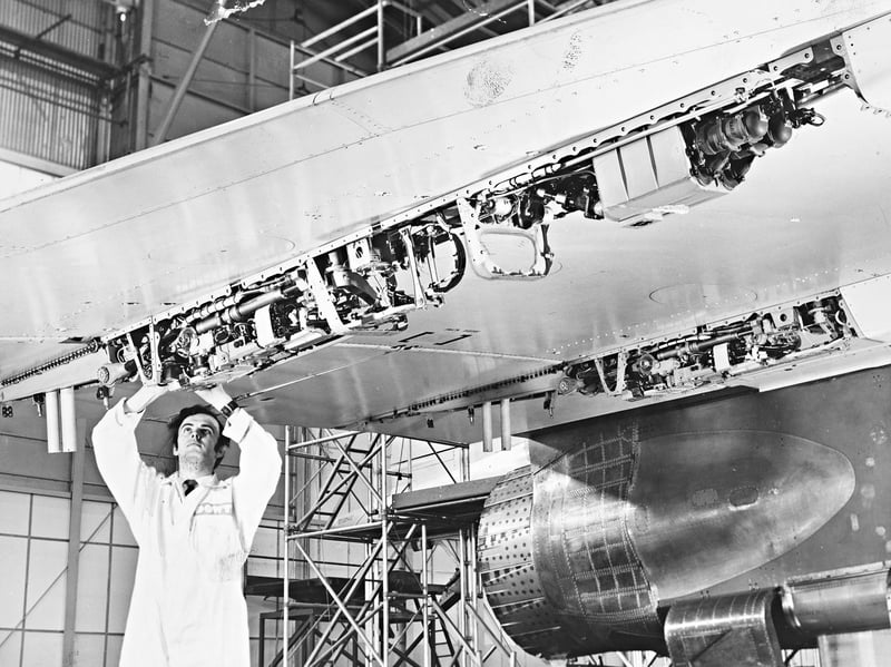 Reaching up inside a complex under-wing housing, a Dowty Boulton Paul service engineer performs meticulous checks on a powered flying control unit fitted to a Concorde airliner on July 24, 1970. Manufactured at the company’s Pendeford works in Wolverhampton, these essential control systems had just secured a major milestone - a £1 million contract to supply the flying controls for the first six production Concordes. The striking photo highlights the incredible local expertise and advanced aerospace craftsmanship that helped keep the world’s most iconic iconic passenger jet soaring safely through the skies. Do you remember the sense of local pride surrounding Dowty Boulton Paul’s crucial role in the Concorde project? Did you or any family members work in the manufacturing or servicing of high-tech aviation parts back in 1970?