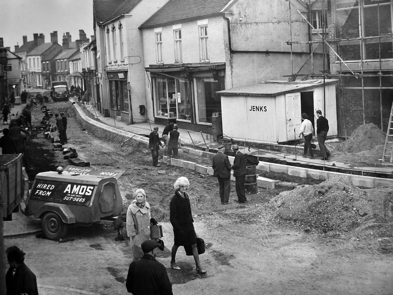 Dawley High Street was a hive of activity in April 1967 as road works got under way to resurface the main shopping street. The closure caused frustration among traders, shoppers and councillors, with concerns that four weeks was too long for such an important route to be closed. Do you remember navigating around road works like these, or the shops and businesses that once lined Dawley High Street?