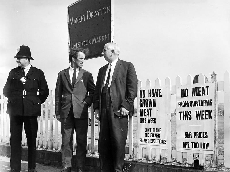 A glimpse of Market Drayton’s livestock market, believed to date from around 1967. PC G Lewis is pictured with Mr Peter Denne and Mr R Ingham in a scene that reflects the important role livestock markets played in everyday life across Shropshire. Do you remember visiting Market Drayton market, the bustle of sale days, and the familiar faces who gathered there?